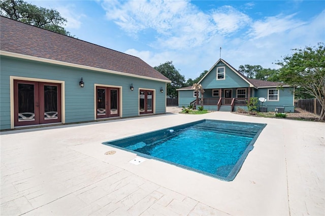 123 Bishop Rd, Rockport, TX 78382 - view of swimming pool with french doors, a patio area, and central air condition unit