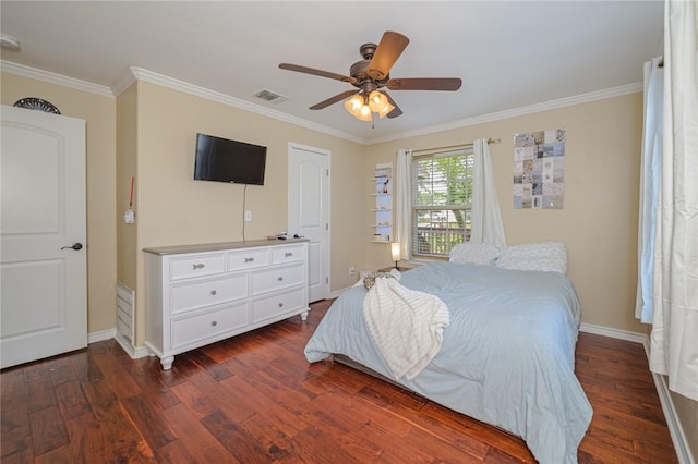123 Bishop Rd, Rockport, TX 78382 - bedroom featuring ornamental molding, dark wood-style floors, baseboards, and ceiling fan