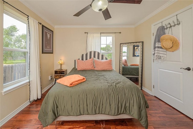 123 Bishop Rd, Rockport, TX 78382 - bedroom featuring ornamental molding, dark wood finished floors, baseboards, and ceiling fan