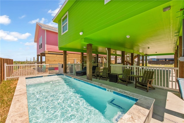 view of swimming pool with a patio