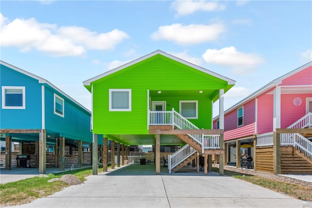 coastal home with covered porch and a carport