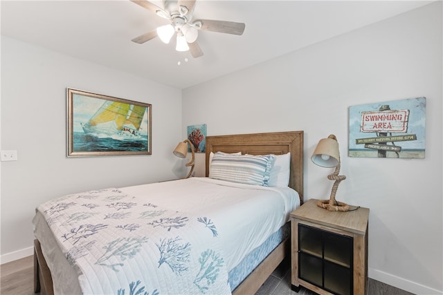 bedroom featuring hardwood / wood-style floors and ceiling fan