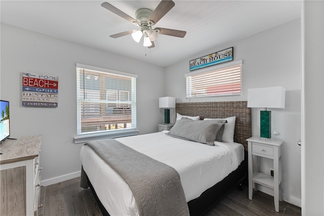 bedroom with dark hardwood / wood-style flooring and ceiling fan