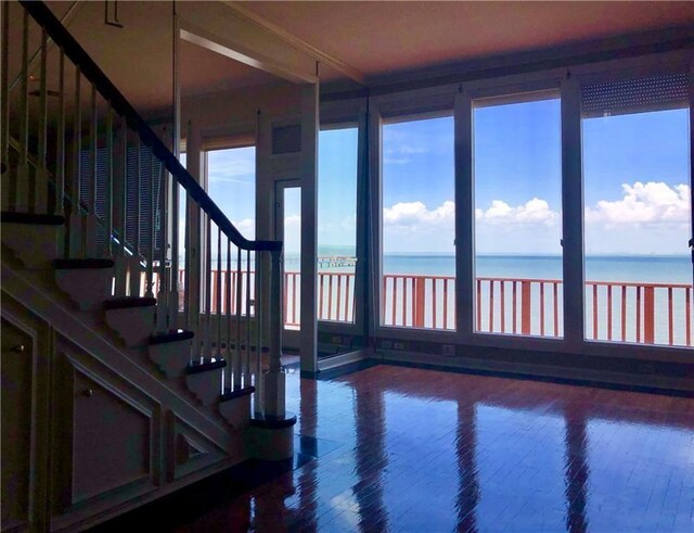 4454 Ocean Dr Unit 4, Corpus Christi, TX 78412 - stairs featuring a water view and wood finished floors