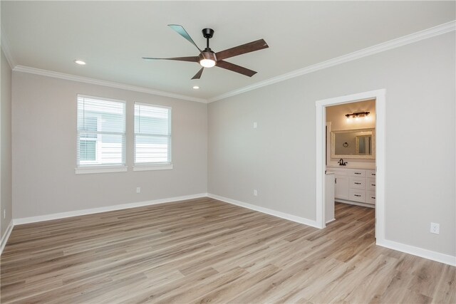 empty room with ornamental molding, ceiling fan, and light hardwood / wood-style flooring