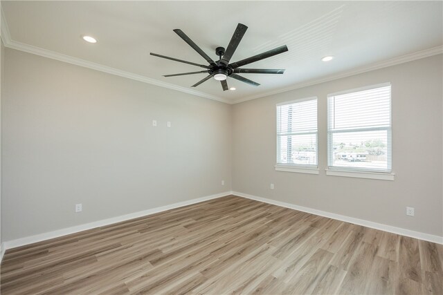 empty room with light hardwood / wood-style floors, ceiling fan, and crown molding