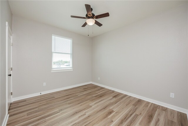 unfurnished room with light hardwood / wood-style flooring and ceiling fan