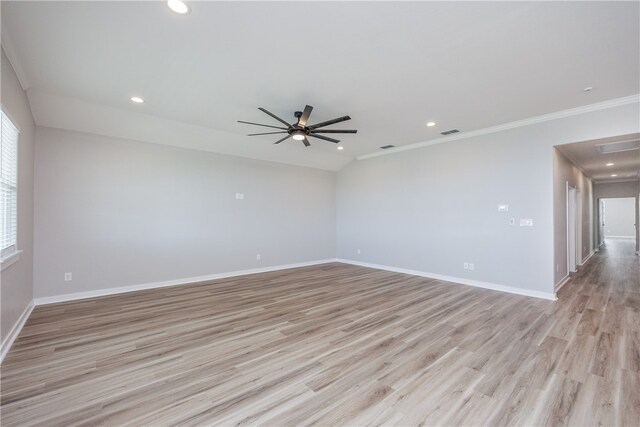 unfurnished room featuring ceiling fan, light hardwood / wood-style floors, and ornamental molding