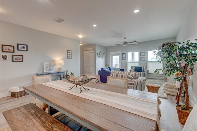 dining space featuring baseboards, visible vents, a ceiling fan, wood finished floors, and recessed lighting