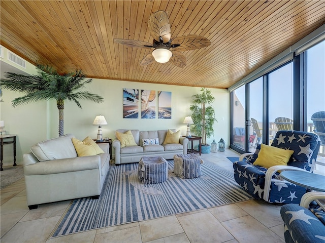 interior space featuring ceiling fan, crown molding, and wood ceiling