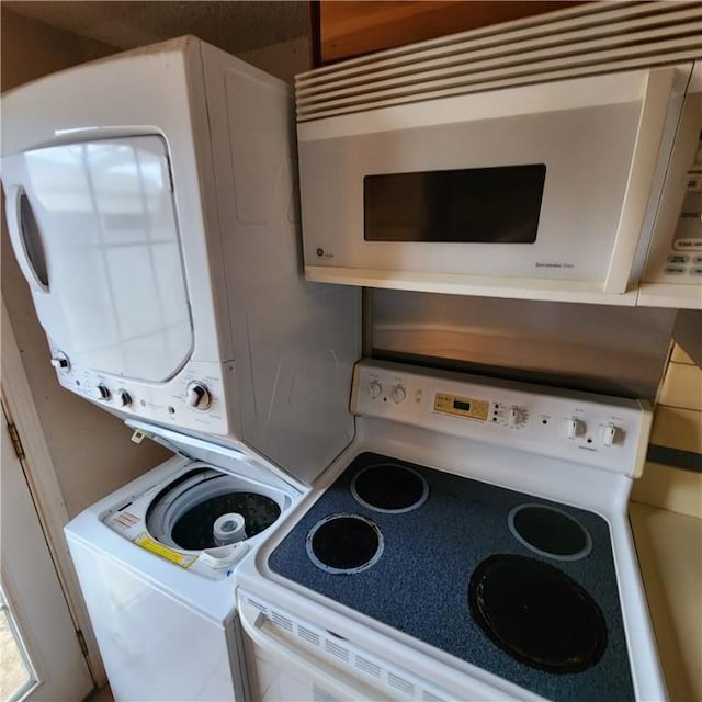 washroom with laundry area and stacked washer and clothes dryer