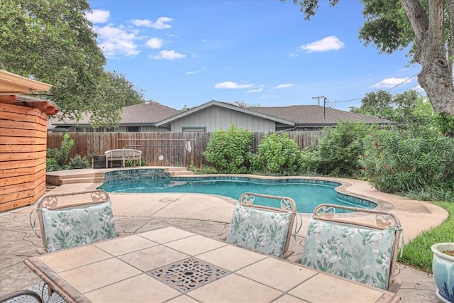 view of pool featuring a patio area, a fenced backyard, and a fenced in pool