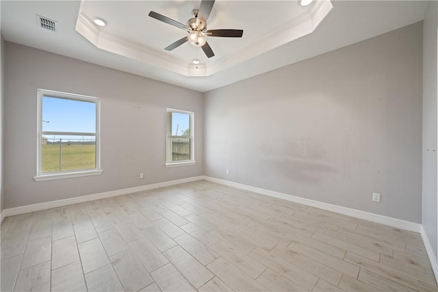 1706 Kentucky Derby Dr, Corpus Christi, TX 78417 - spare room featuring a ceiling fan, a raised ceiling, baseboards, and a healthy amount of sunlight