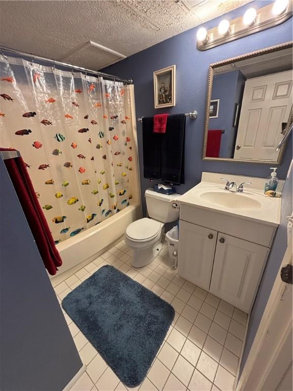 3938 Surfside Blvd Unit 2235, Corpus Christi, TX 78402 - full bathroom with shower / tub combo, vanity, tile patterned flooring, and a textured ceiling
