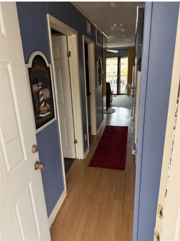 3938 Surfside Blvd Unit 2235, Corpus Christi, TX 78402 - hall featuring wood finished floors