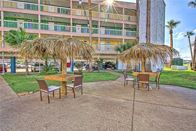 3938 Surfside Blvd Unit 2235, Corpus Christi, TX 78402 - view of home's community with outdoor dining area, a patio, and a yard