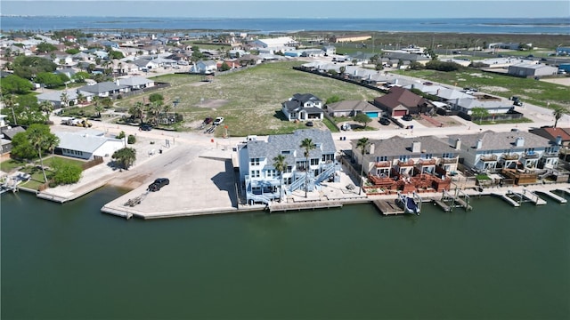 drone / aerial view featuring a water view and a residential view