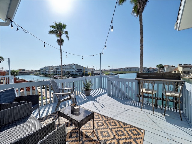 wooden deck with a water view