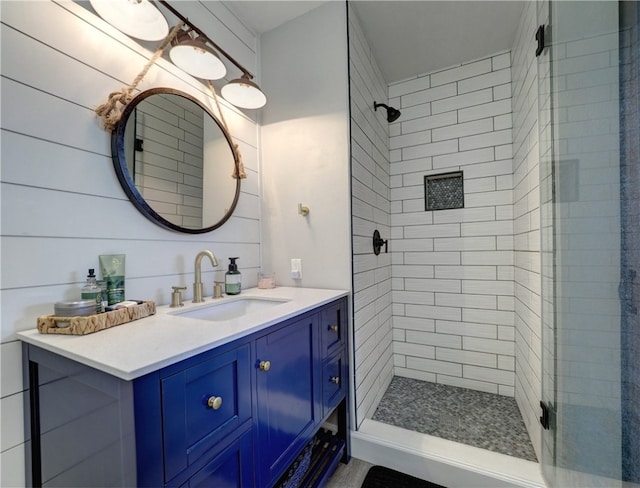 full bathroom featuring a shower stall and vanity