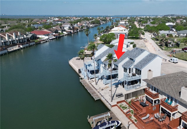 aerial view with a water view and a residential view