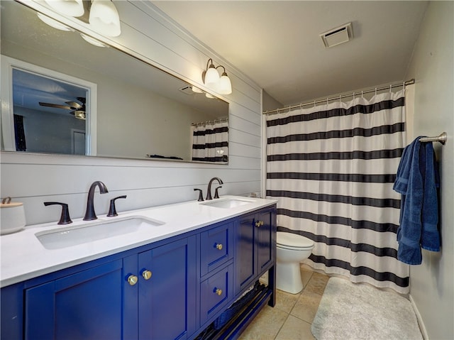 full bathroom with double vanity, visible vents, toilet, and a sink