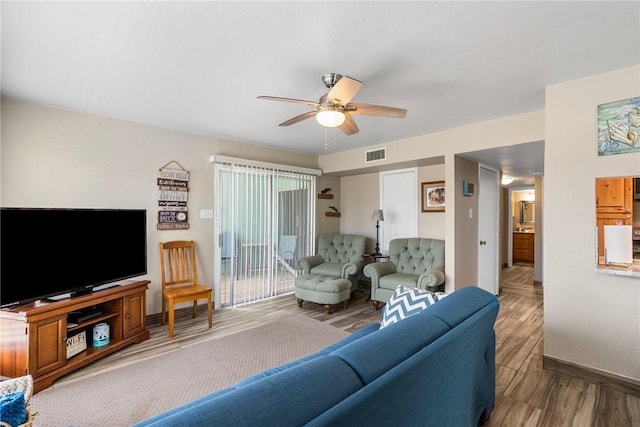 14300 Aloha St N Unit 139, Corpus Christi, TX 78418 - living area with wood finished floors and ceiling fan