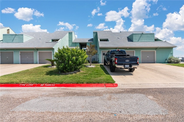 ranch-style house with a front lawn and a garage