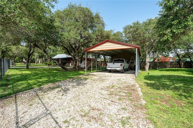 507 S Terry St, Rockport, TX 78382 - view of parking featuring gravel driveway and a carport