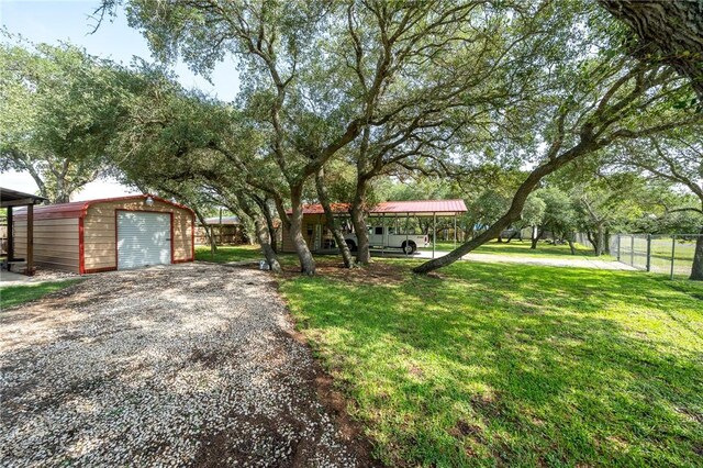 507 S Terry St, Rockport, TX 78382 - view of front of home with an outbuilding and gravel driveway