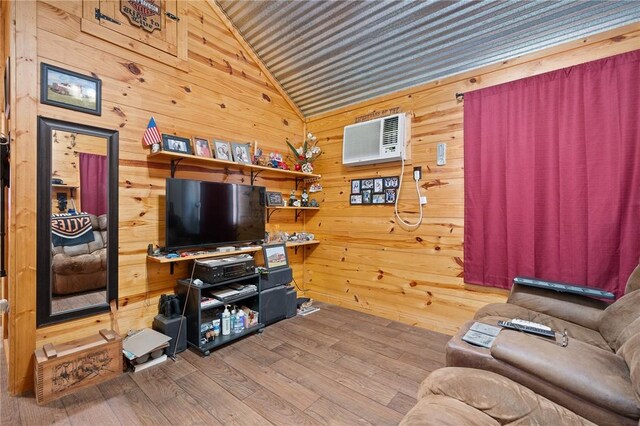 507 S Terry St, Rockport, TX 78382 - living area with wooden walls, lofted ceiling, a wall unit AC, and wood finished floors