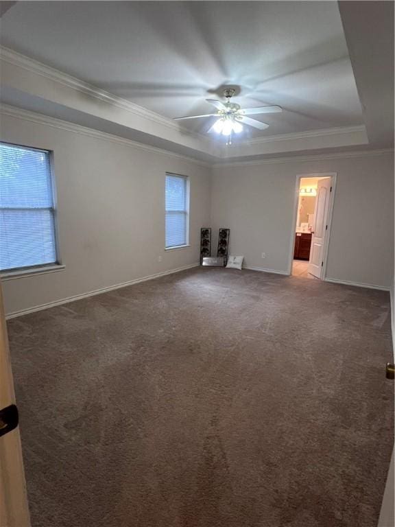 7145 Cano Ln, Corpus Christi, TX 78414 - unfurnished room featuring a tray ceiling, crown molding, carpet flooring, and baseboards