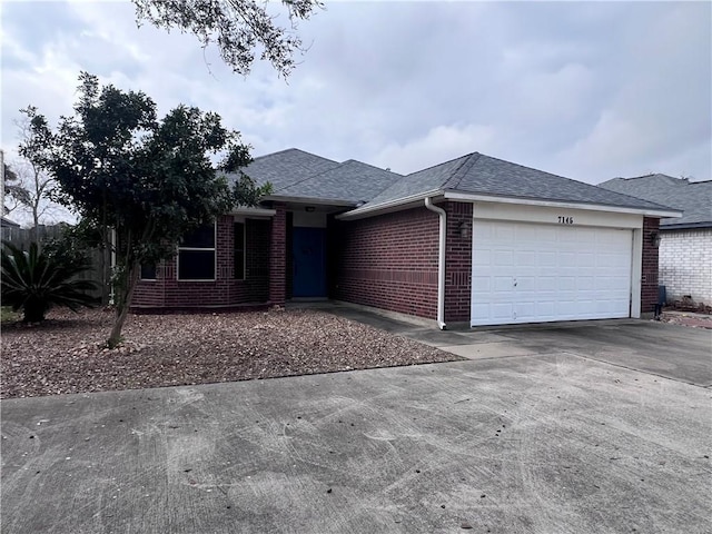 7145 Cano Ln, Corpus Christi, TX 78414 - ranch-style home featuring an attached garage, a shingled roof, brick siding, and driveway