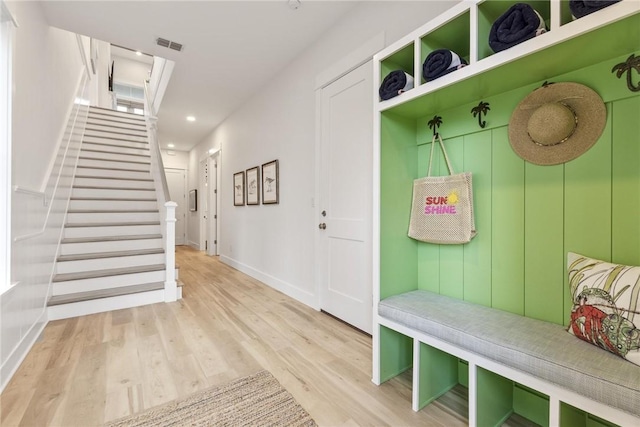 mudroom featuring wood finished floors, recessed lighting, visible vents, and baseboards