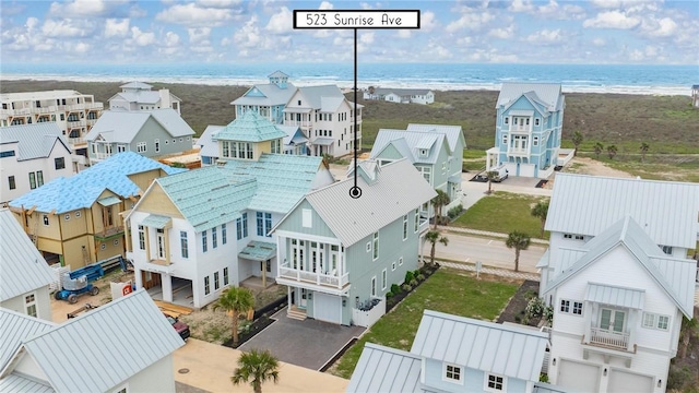 birds eye view of property featuring a residential view and a water view