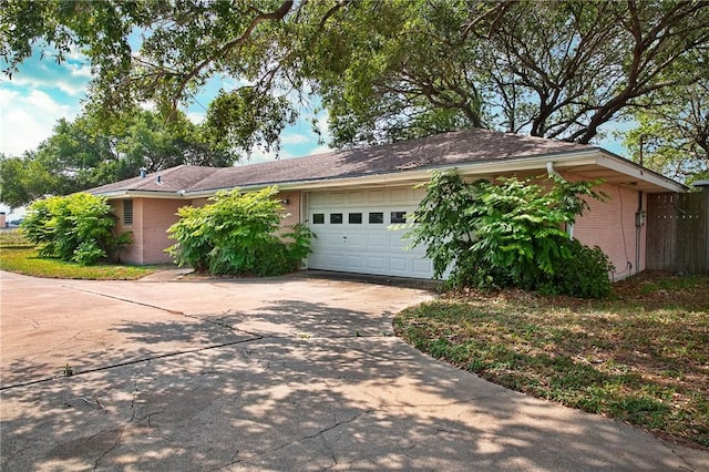 3701 Ih 69 Access Hwy, Corpus Christi, TX 78410 - view of front of home with an attached garage, concrete driveway, and brick siding