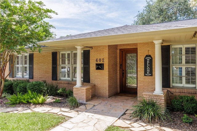 doorway to property featuring covered porch