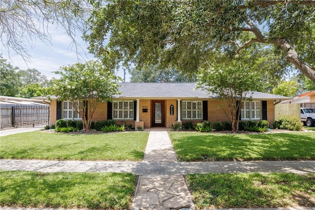 ranch-style home with a front lawn