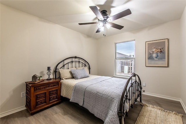 bedroom with ceiling fan and wood-type flooring