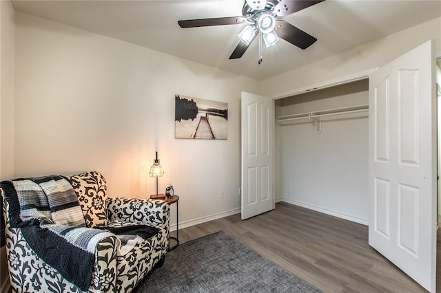 living area featuring ceiling fan and hardwood / wood-style floors