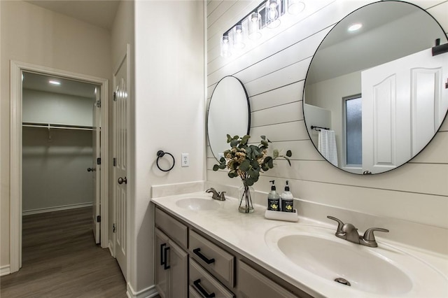 bathroom featuring vanity and hardwood / wood-style floors