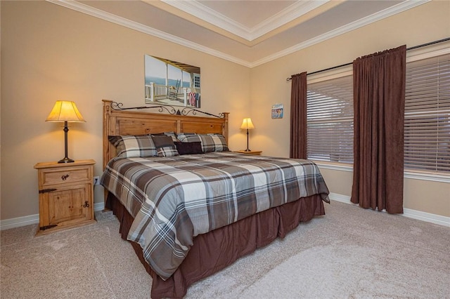 bedroom featuring ornamental molding, a raised ceiling, light carpet, and baseboards