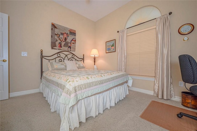 bedroom with carpet and baseboards