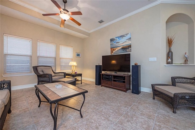 living area featuring baseboards, visible vents, and ornamental molding