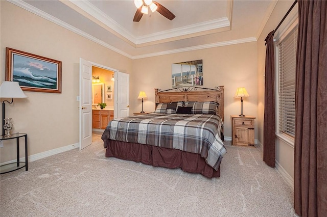 bedroom featuring carpet, a raised ceiling, and baseboards