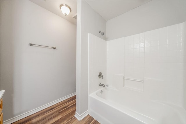2602 Windhollow Dr, Corpus Christi, TX 78414 - bathroom with wood finished floors, vanity, and washtub / shower combination