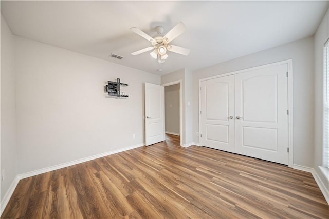 2602 Windhollow Dr, Corpus Christi, TX 78414 - unfurnished bedroom featuring wood finished floors, a closet, and a ceiling fan