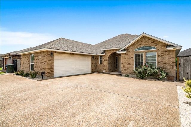 2602 Windhollow Dr, Corpus Christi, TX 78414 - ranch-style house with brick siding, an attached garage, concrete driveway, and a shingled roof
