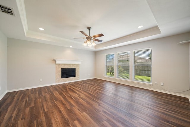 2602 Windhollow Dr, Corpus Christi, TX 78414 - unfurnished living room with a raised ceiling, dark wood finished floors, a tile fireplace, recessed lighting, and ceiling fan
