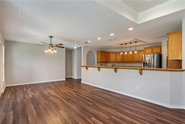 2602 Windhollow Dr, Corpus Christi, TX 78414 - unfurnished living room with recessed lighting, a raised ceiling, dark wood-type flooring, ornamental molding, and a ceiling fan