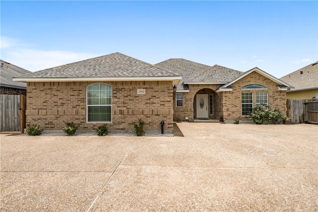 2602 Windhollow Dr, Corpus Christi, TX 78414 - view of front of property with brick siding and a shingled roof